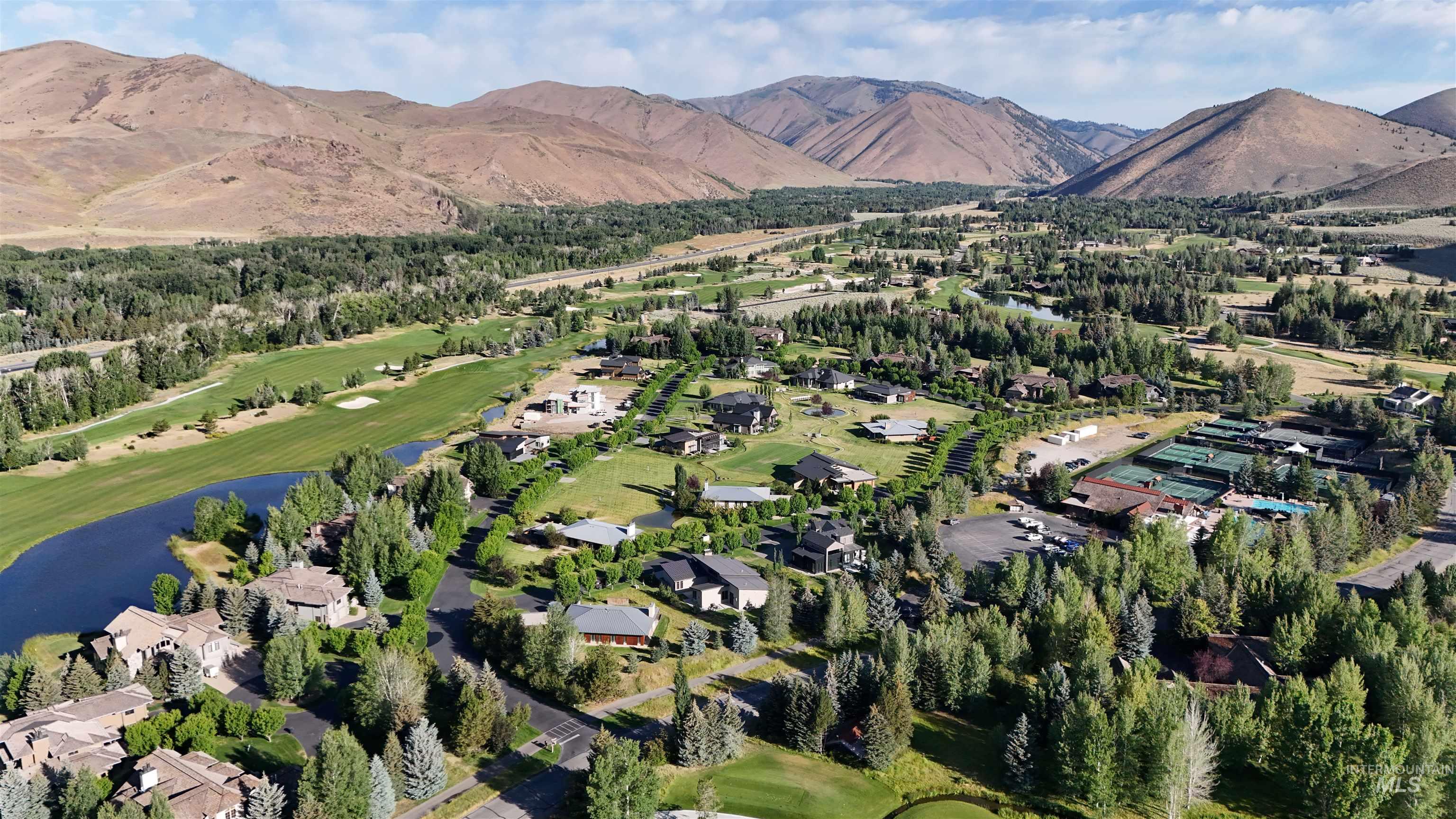 27 Streamside Drive Hailey, ID 83333 - Photo 32 of 39 Aerial view of property's location with a golf club, a water and mountain view, and nearby suburban area