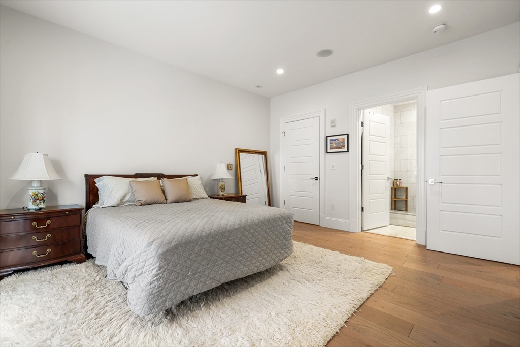 205 E Street, Unit 8N Boston, MA 02127 - Photo 14 of 29 a bedroom with a bed and closet