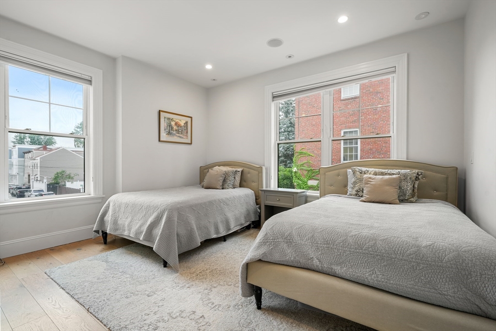 205 E Street, Unit 8N Boston, MA 02127 - Photo 17 of 29 a bedroom with two beds and a large window