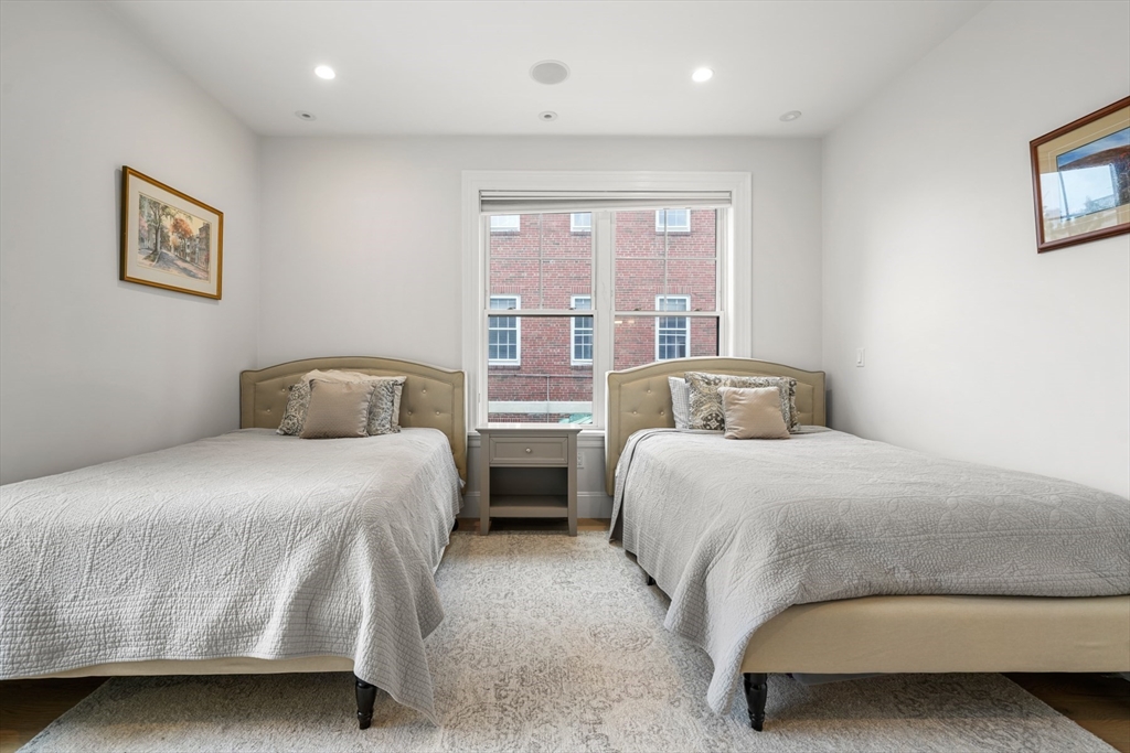 205 E Street, Unit 8N Boston, MA 02127 - Photo 18 of 29 a bedroom with a large bed and a large window