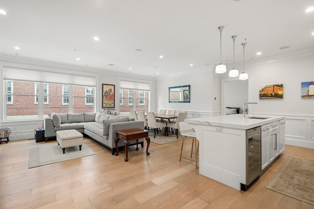 205 E Street, Unit 8N Boston, MA 02127 - Photo 2 of 29 a large white kitchen with cabinets a sink and a stove