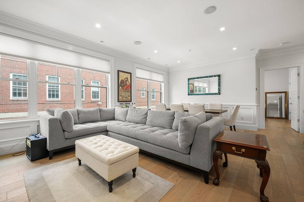 205 E Street, Unit 8N Boston, MA 02127 - Photo 3 of 29 a living room with furniture and a window