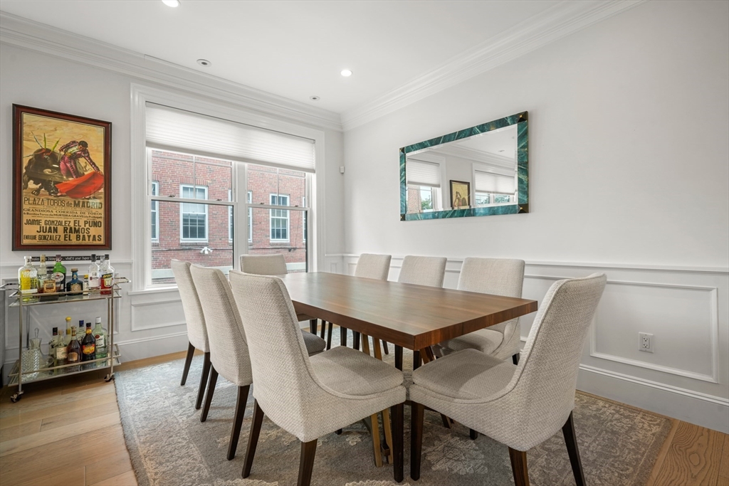 205 E Street, Unit 8N Boston, MA 02127 - Photo 9 of 29 a view of a dining room with furniture and chandelier