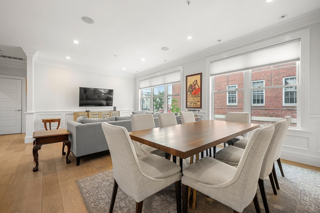 205 E Street, Unit 8N Boston, MA 02127 - Photo 10 of 29 a view of a dining room with furniture and a livingroom