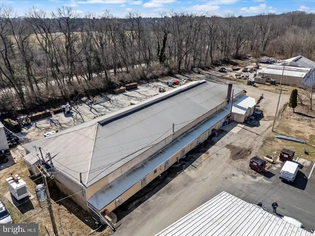 a view of a backyard with sitting area