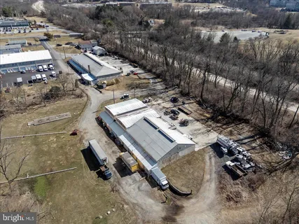 an aerial view of residential house with parking space