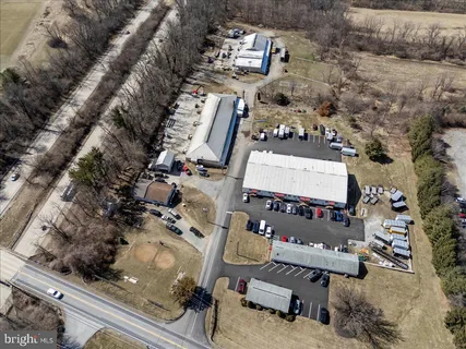 an aerial view of multiple houses with yard