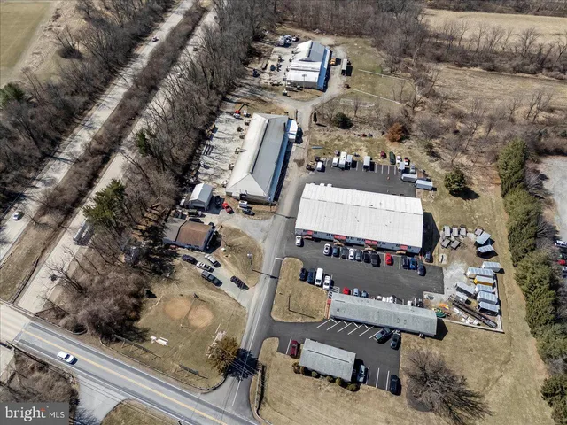 an aerial view of multiple houses with yard