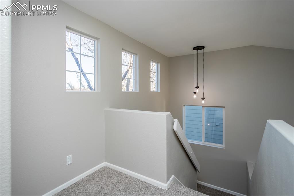 890 Rancher Drive Fountain, CO 80817 - Photo 22 of 42 The upstairs landing is even filled with light.
