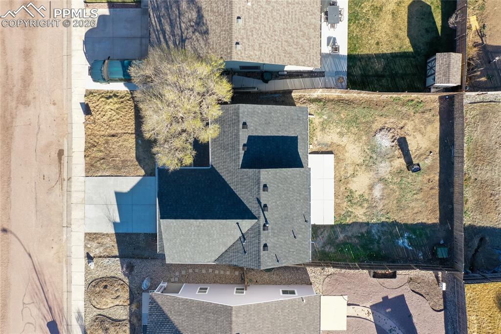 890 Rancher Drive Fountain, CO 80817 - Photo 36 of 42 Shows the new roof, new driveway, new patio and large fenced.