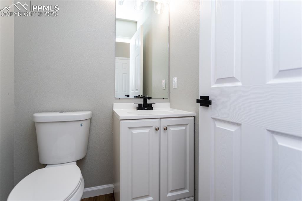 890 Rancher Drive Fountain, CO 80817 - Photo 8 of 42 Powder bath is just off the entry.