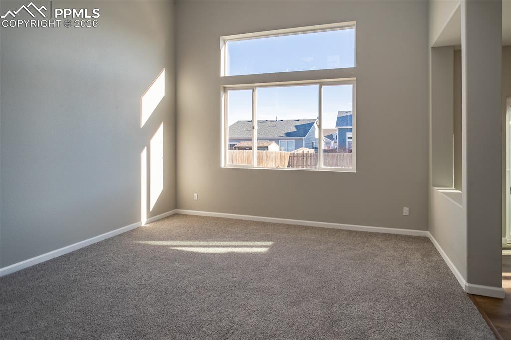 890 Rancher Drive Fountain, CO 80817 - Photo 9 of 42 the 2 story living room is flooded with light.