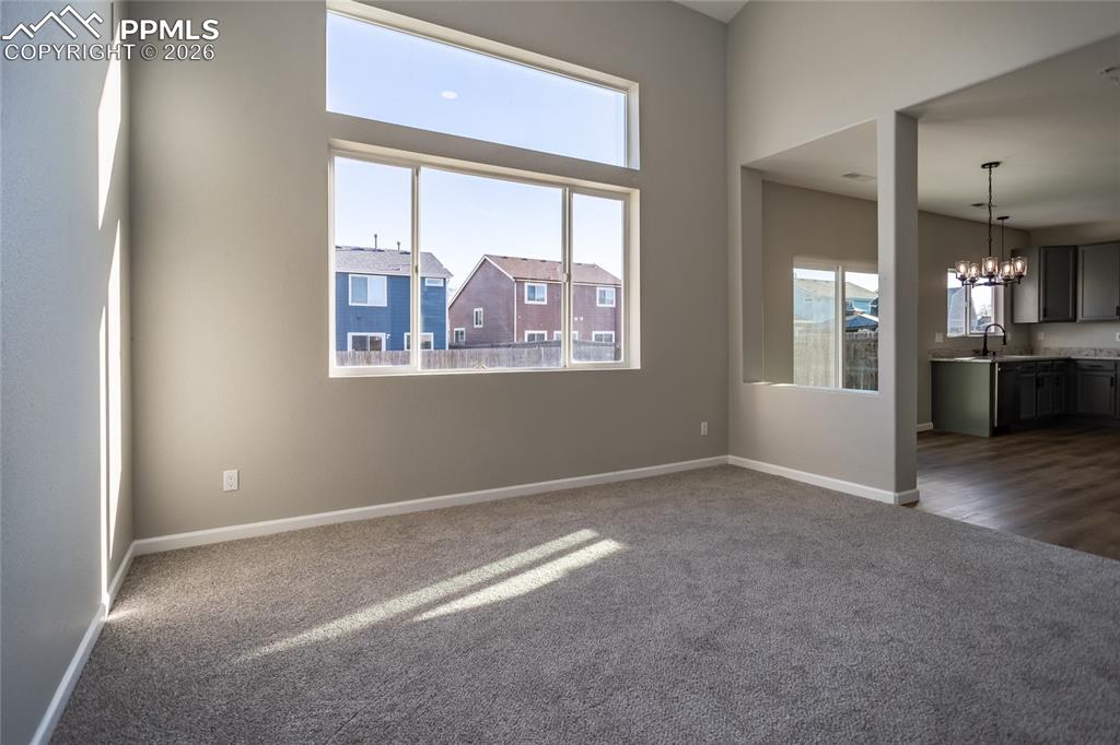 890 Rancher Drive Fountain, CO 80817 - Photo 10 of 42 The living room is open to the kitchen and dining area.