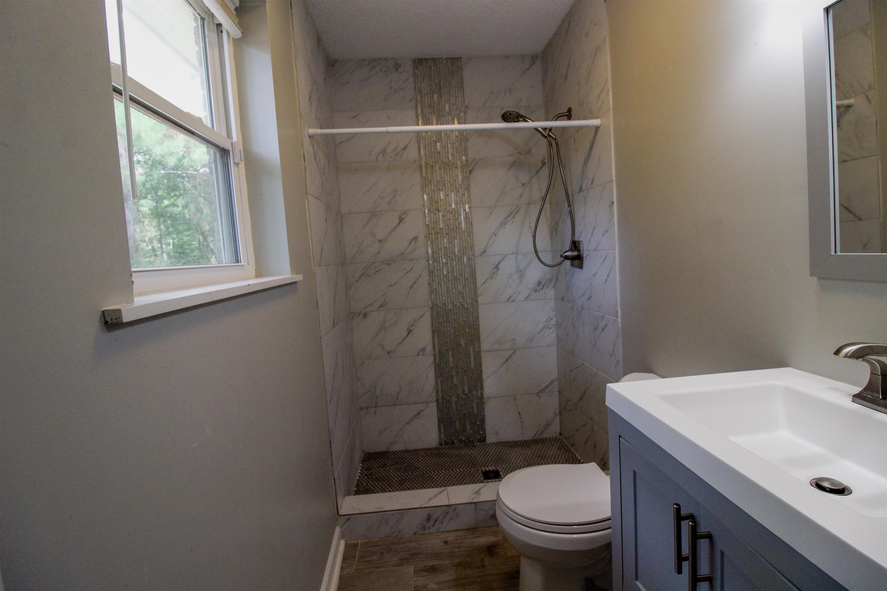 2089 Ralph Road Covington, TN 38019 - Photo 22 of 28 Full bath featuring vanity and a stall shower