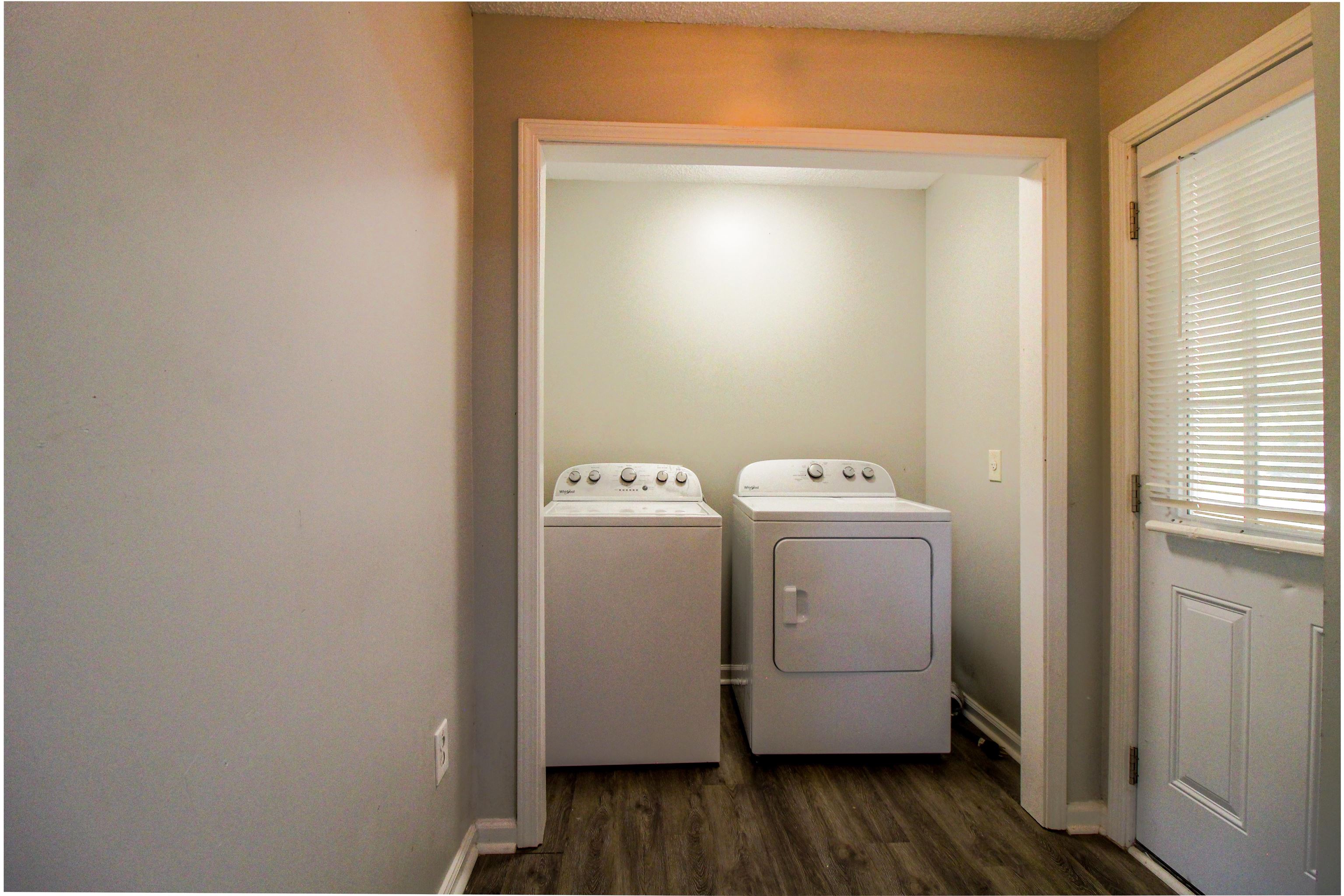 2089 Ralph Road Covington, TN 38019 - Photo 23 of 28 Laundry area with dark wood-type flooring and independent washer and dryer