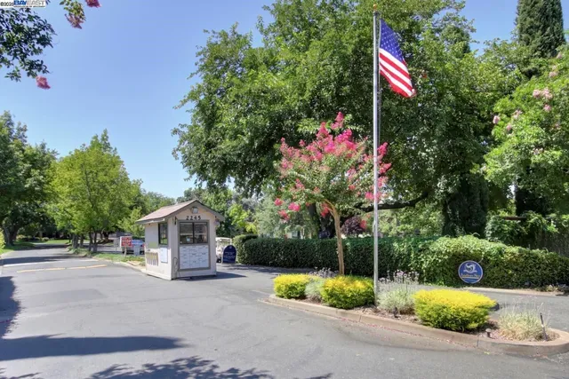 a sign that is sitting in front of a house