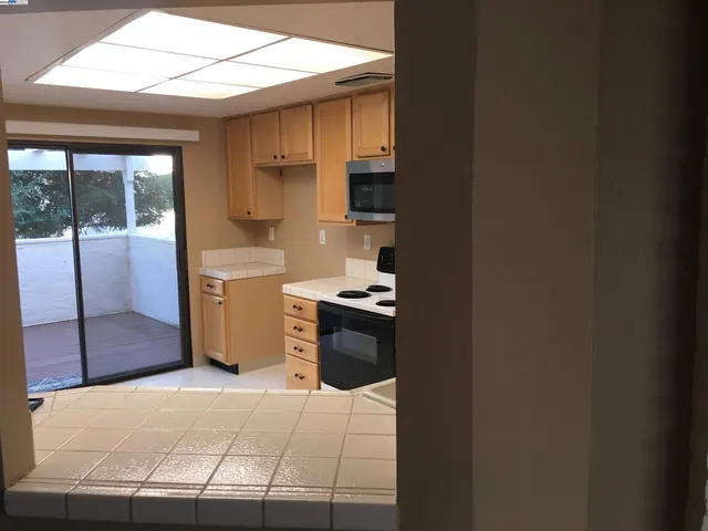 a kitchen with stainless steel appliances a refrigerator and a stove