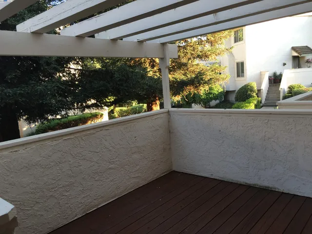 a view of a living room and a floor to ceiling window