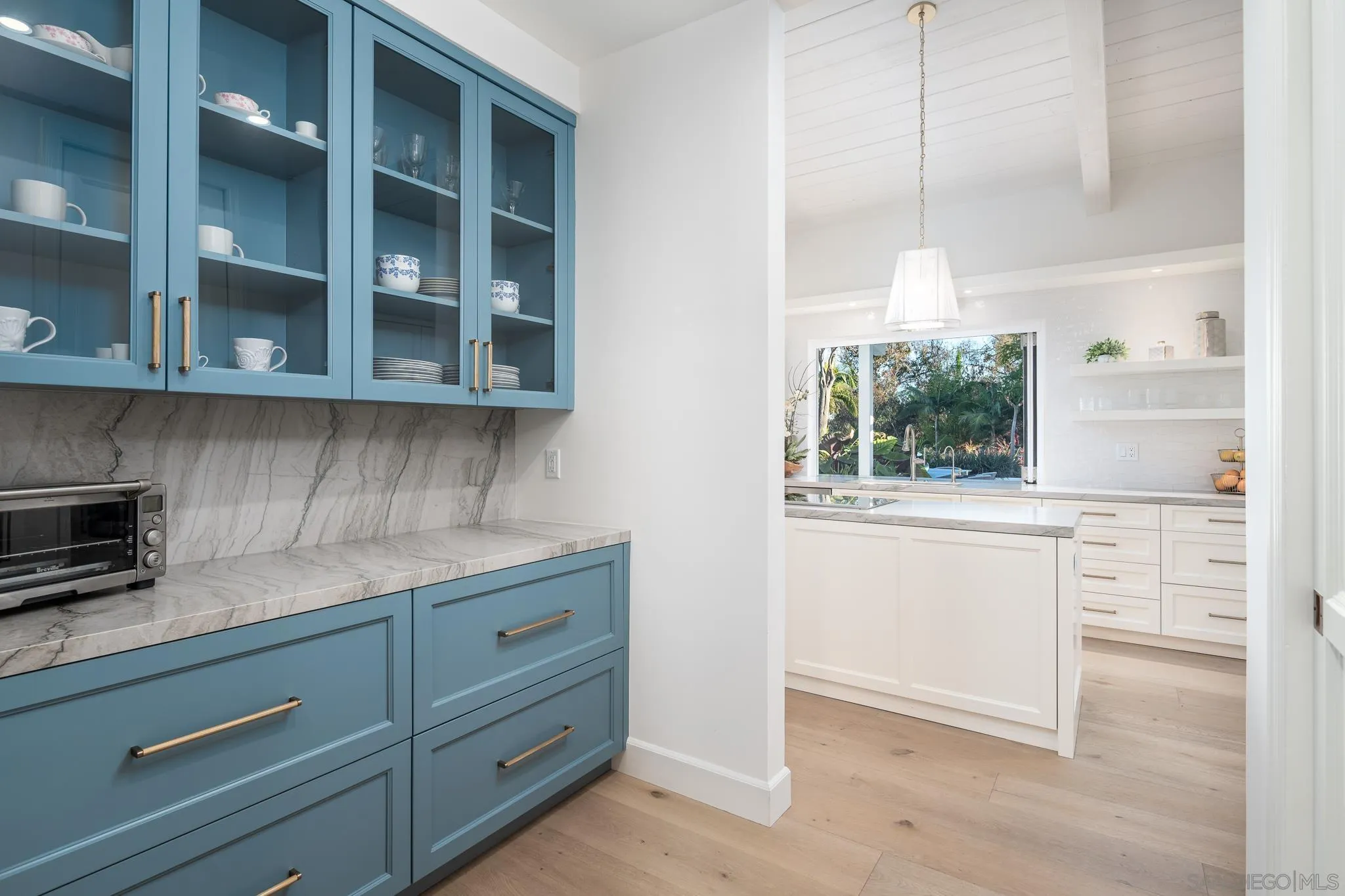 16039 Via Del Alba Rancho Santa Fe, CA 92067 - Photo 15 of 56 a kitchen with a cabinets and window