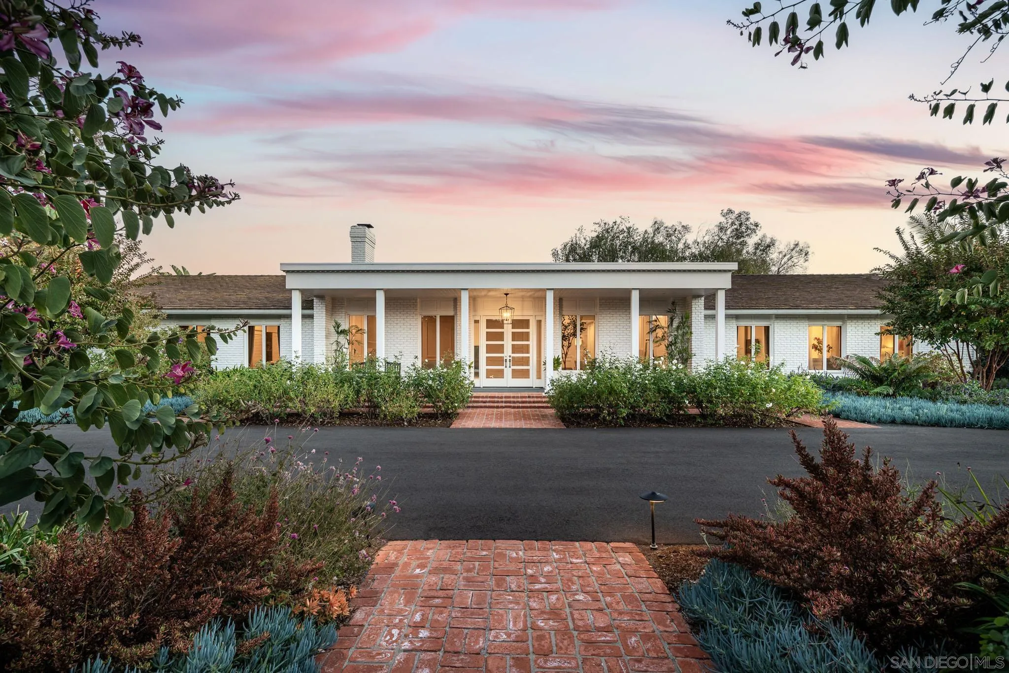 16039 Via Del Alba Rancho Santa Fe, CA 92067 - Photo 2 of 56 a front view of a house with garden