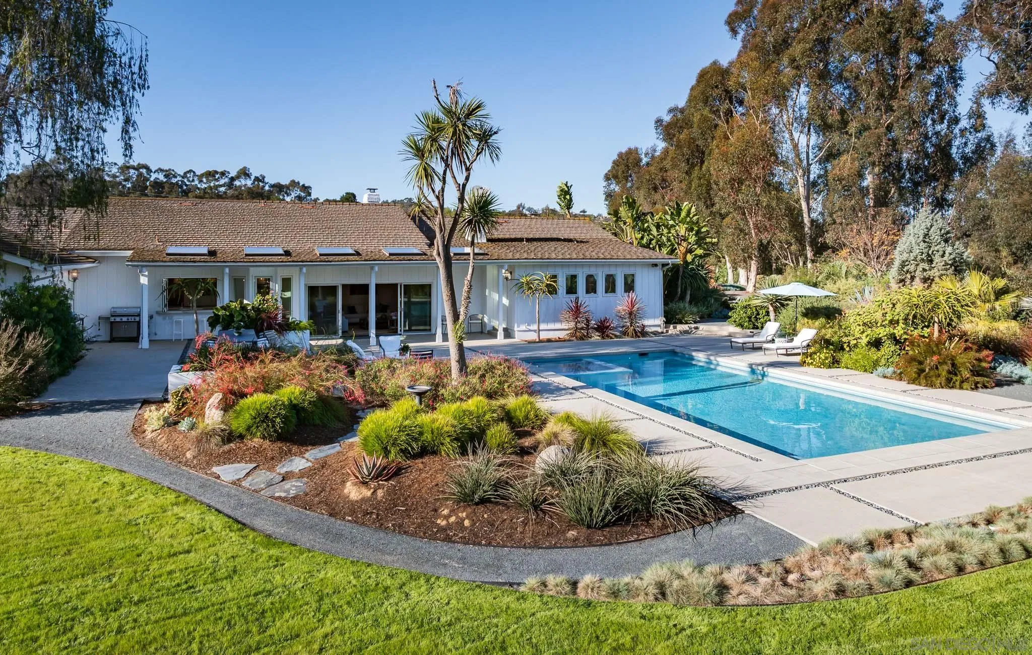 16039 Via Del Alba Rancho Santa Fe, CA 92067 - Photo 26 of 56 a front view of a house with garden