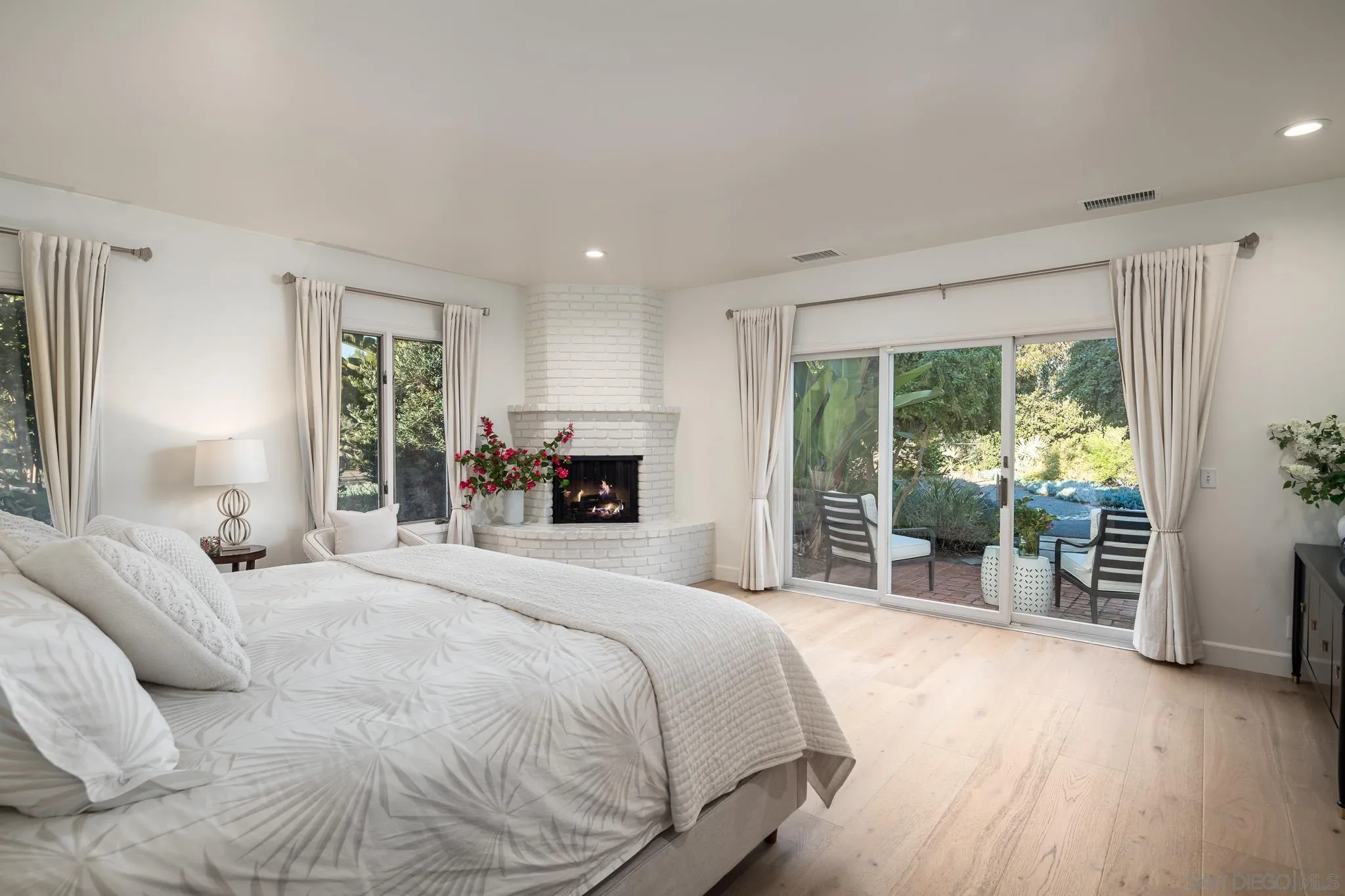 16039 Via Del Alba Rancho Santa Fe, CA 92067 - Photo 29 of 56 a bedroom with a large bed and a large window