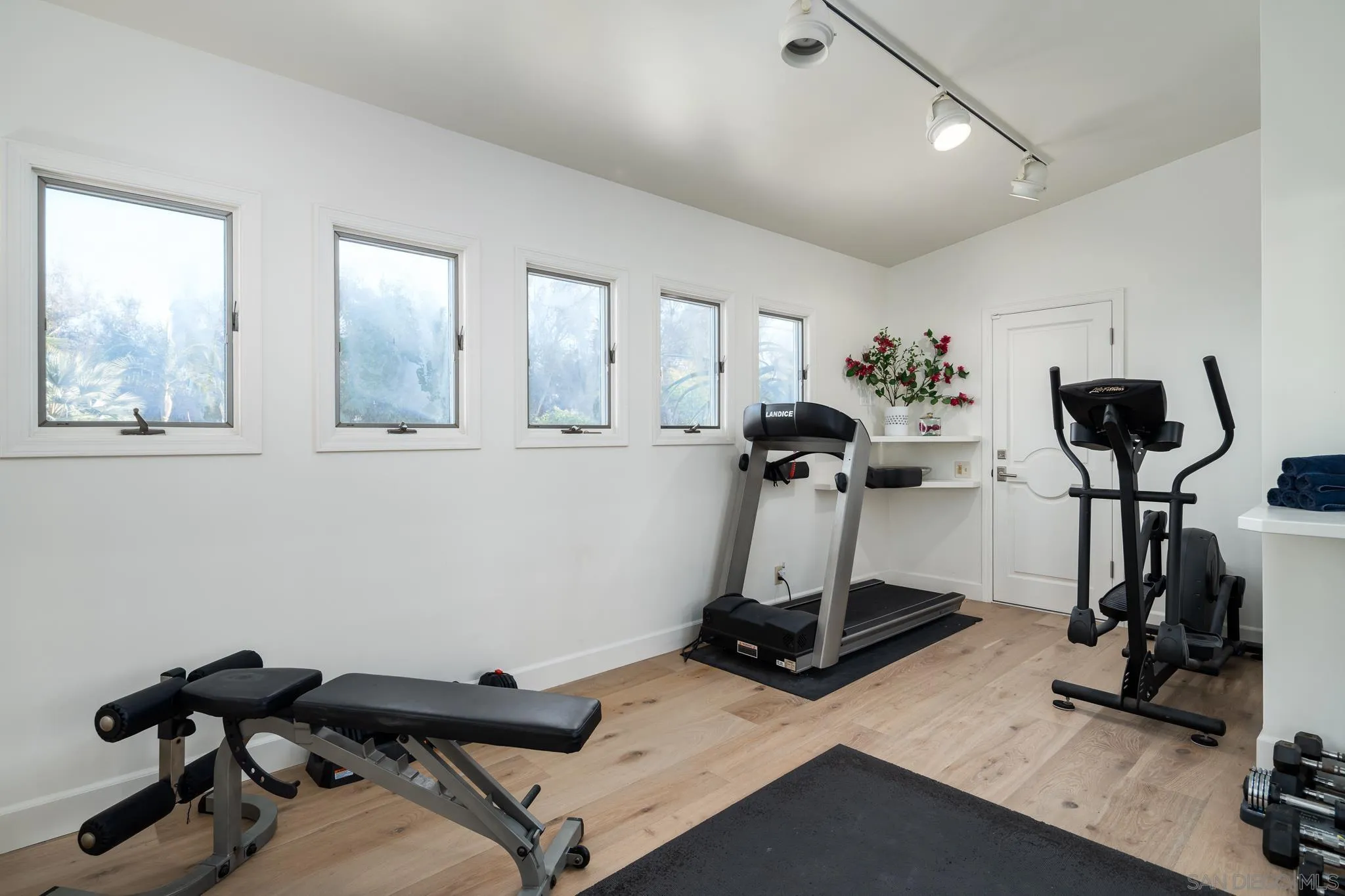 16039 Via Del Alba Rancho Santa Fe, CA 92067 - Photo 31 of 56 a room with gym equipment and windows