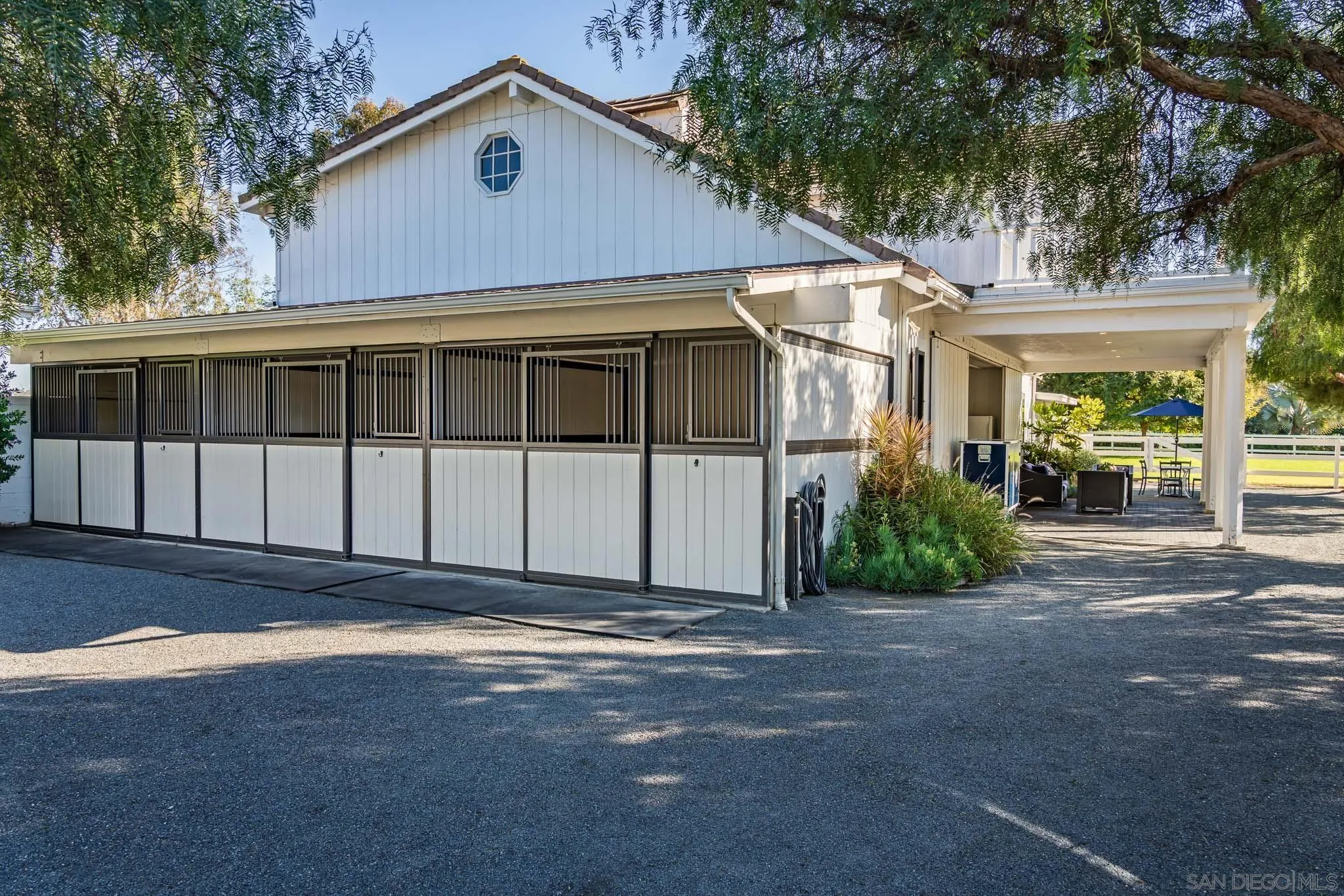 16039 Via Del Alba Rancho Santa Fe, CA 92067 - Photo 39 of 56 a front view of a house with a garden