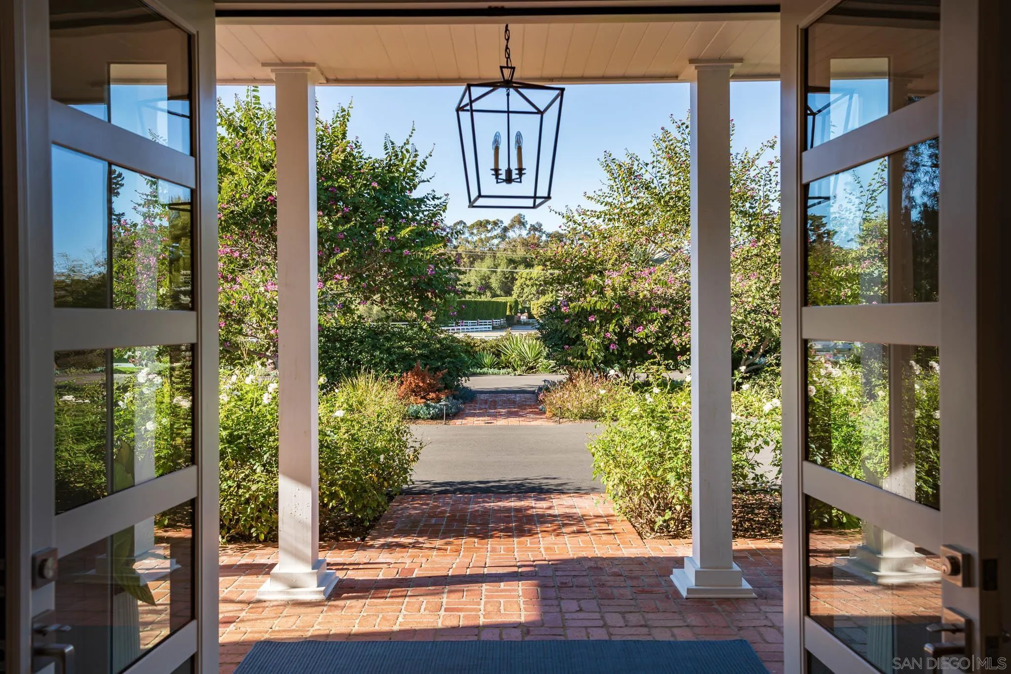 16039 Via Del Alba Rancho Santa Fe, CA 92067 - Photo 5 of 56 a front view of a house with a yard
