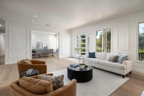 a living room with furniture and windows