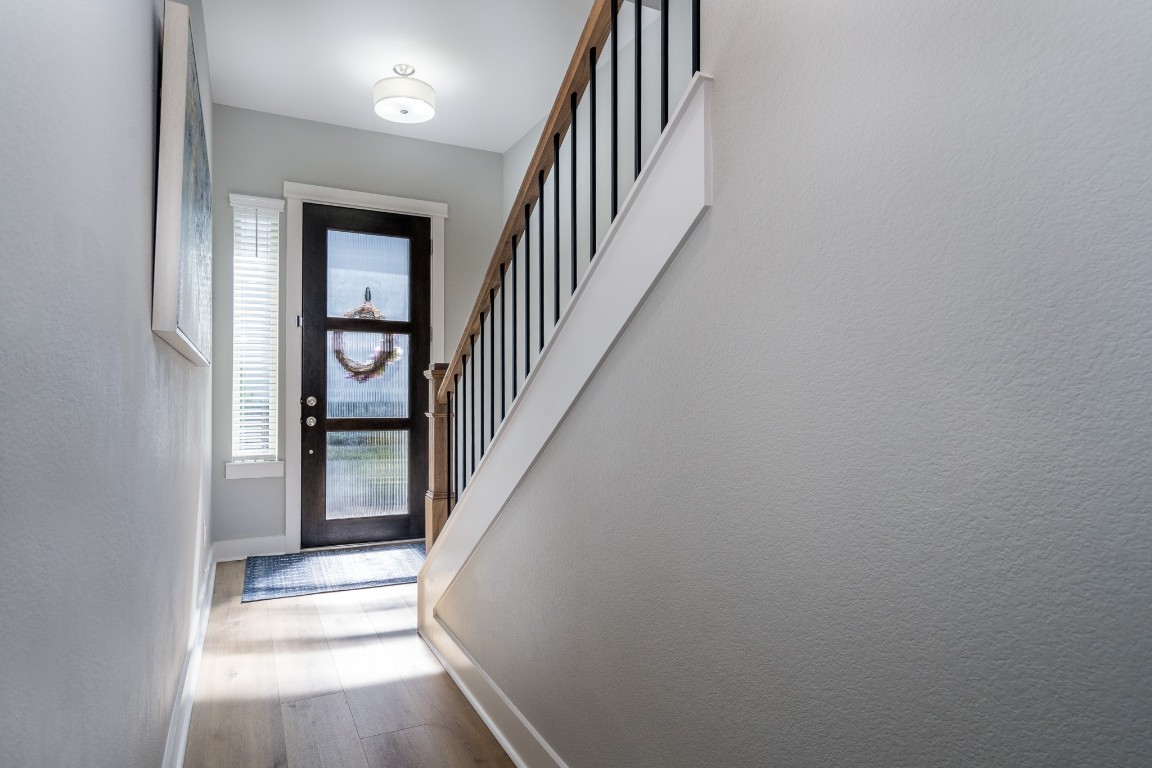968 Ford Pines Lane Houston, TX 77091 - Photo 15 of 34 a view of staircase with railing and white walls