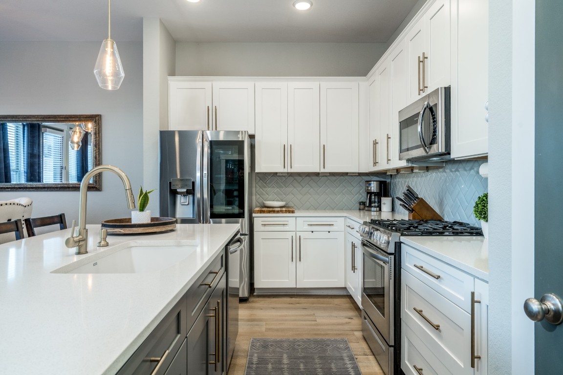 968 Ford Pines Lane Houston, TX 77091 - Photo 2 of 34 a kitchen with stainless steel appliances granite countertop a sink stove and refrigerator