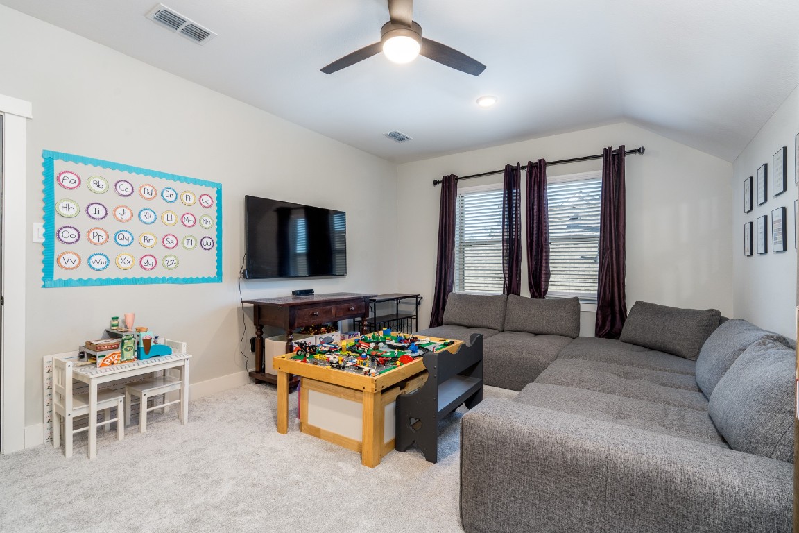 968 Ford Pines Lane Houston, TX 77091 - Photo 22 of 34 a living room with furniture and a flat screen tv