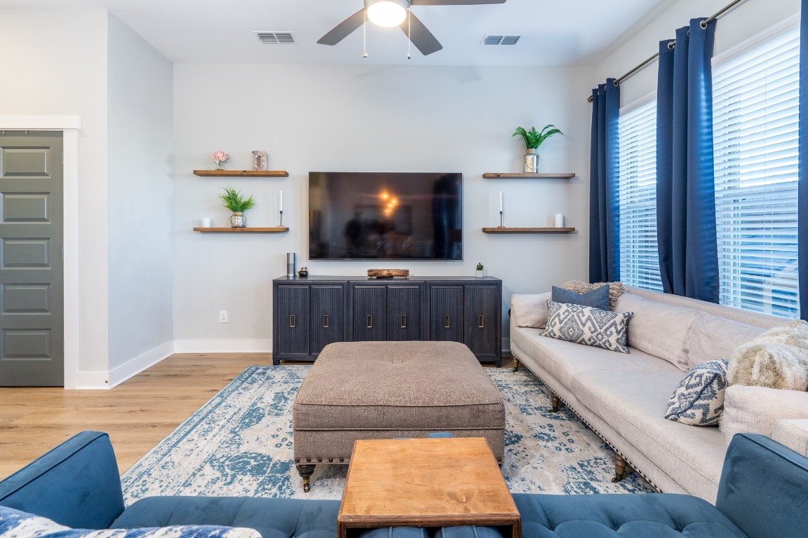 968 Ford Pines Lane Houston, TX 77091 - Photo 10 of 34 a living room with furniture and a flat screen tv