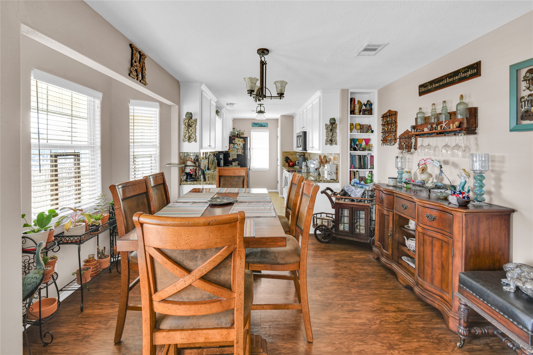 115 Driftwood Road Freeport, TX 77541 - Photo 10 of 21 a view of a dining room with furniture window and wooden floor
