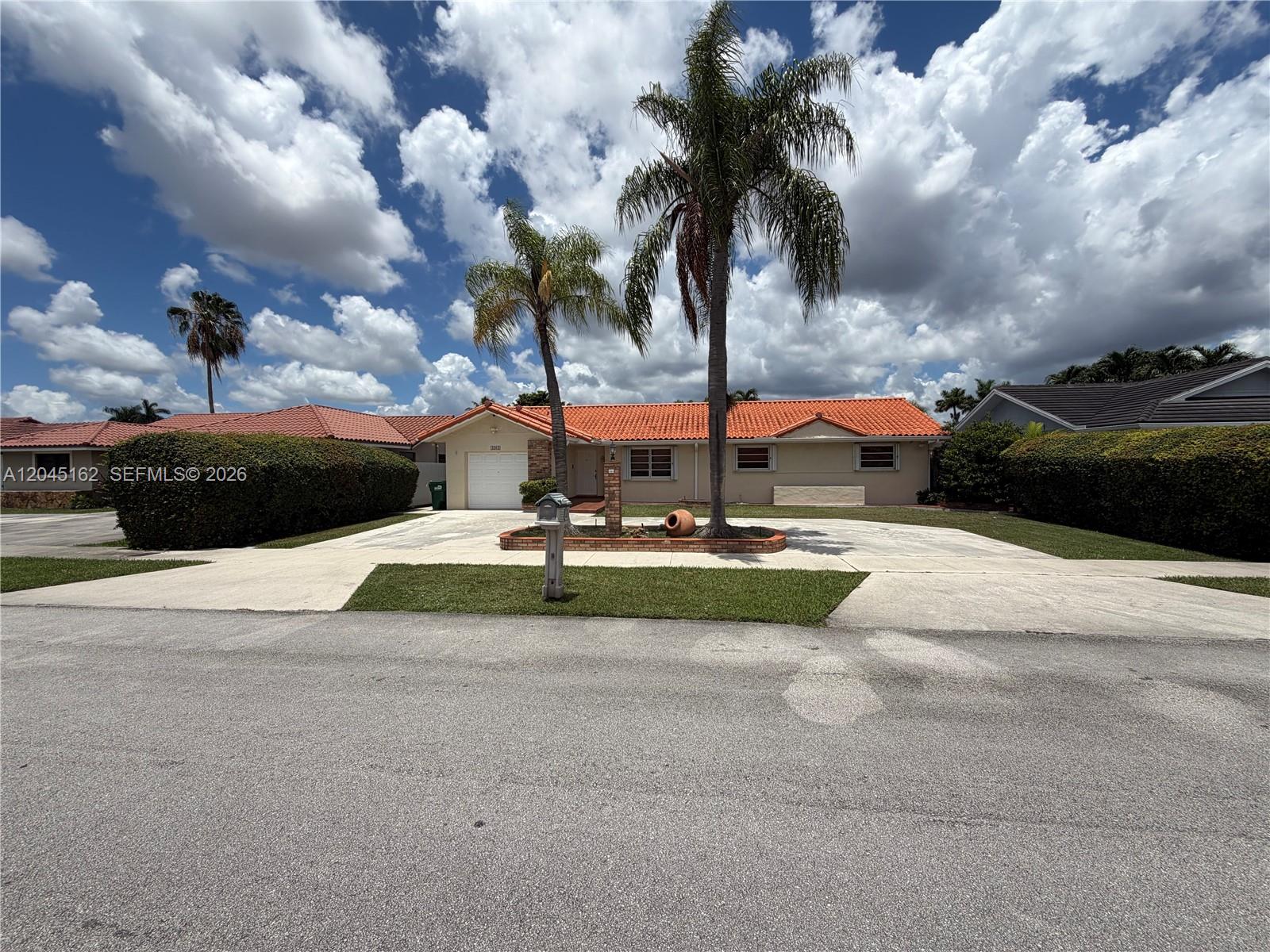 3262 Southwest 139th Place Miami, FL 33175 - Photo 3 of 36 a view of a park with houses and car parked