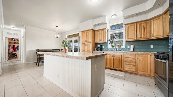 a kitchen with refrigerator and cabinets