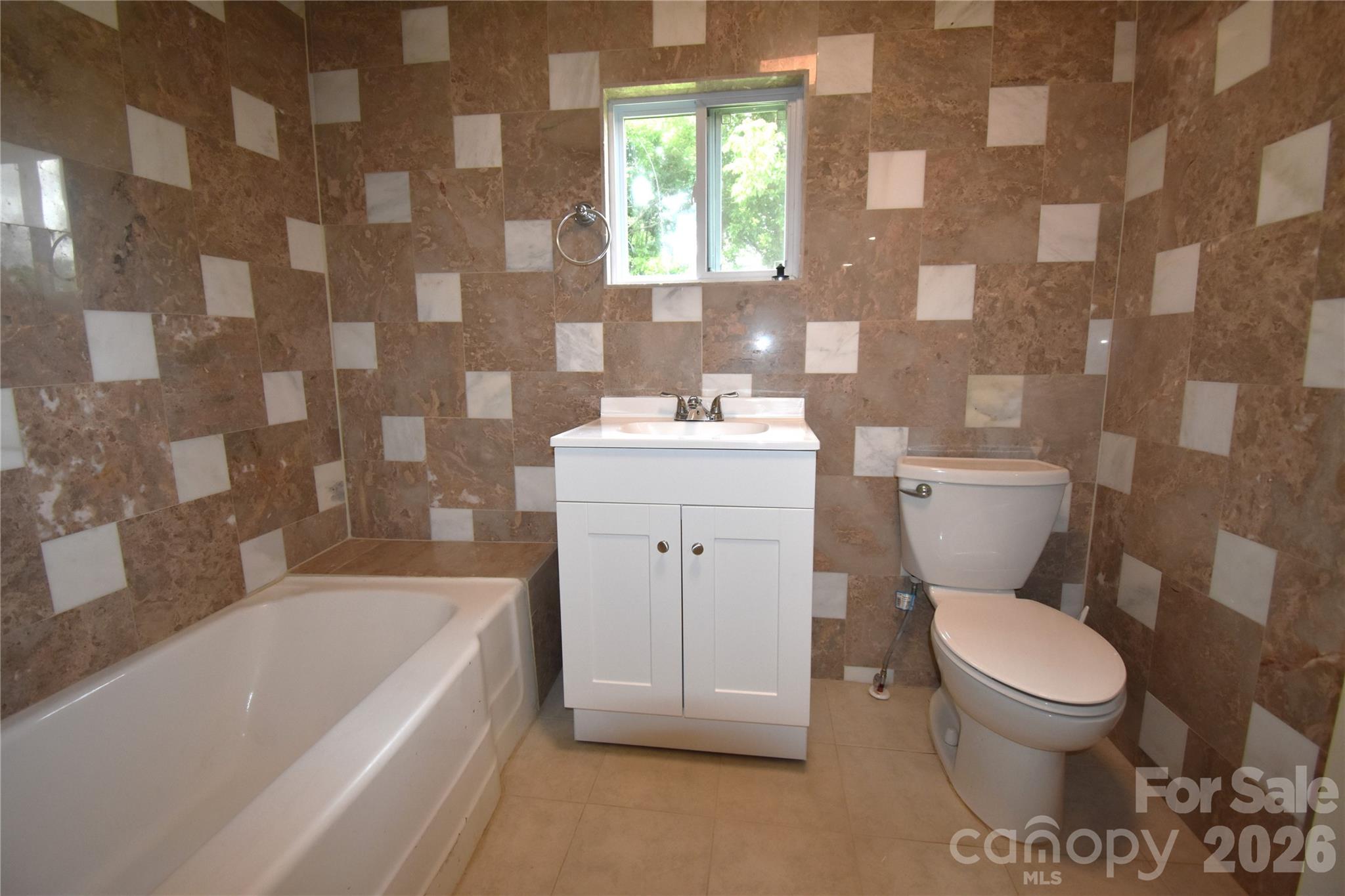 622 Green St Loop Marion, NC 28752 - Photo 11 of 16 a bathroom with a sink toilet vanity and bathtub