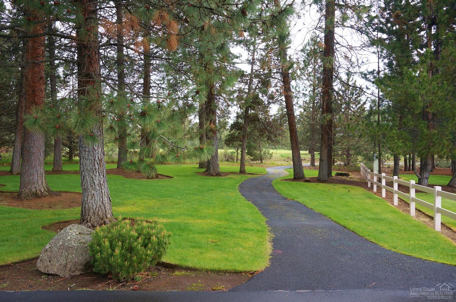 20358 Donkey Sled Road Bend, OR 97702 - Photo 17 of 17 a green field with lots of trees