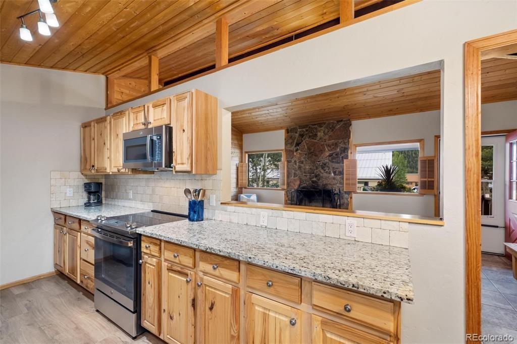 27 East Hanson Road Dillon, CO 80435 - Photo 4 of 25 a kitchen with stainless steel appliances granite countertop a sink and cabinets