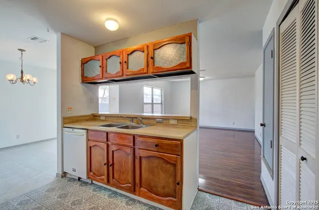 a kitchen with stainless steel appliances granite countertop a stove and a microwave