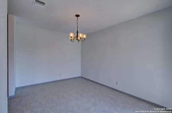 a view of a big room with a window