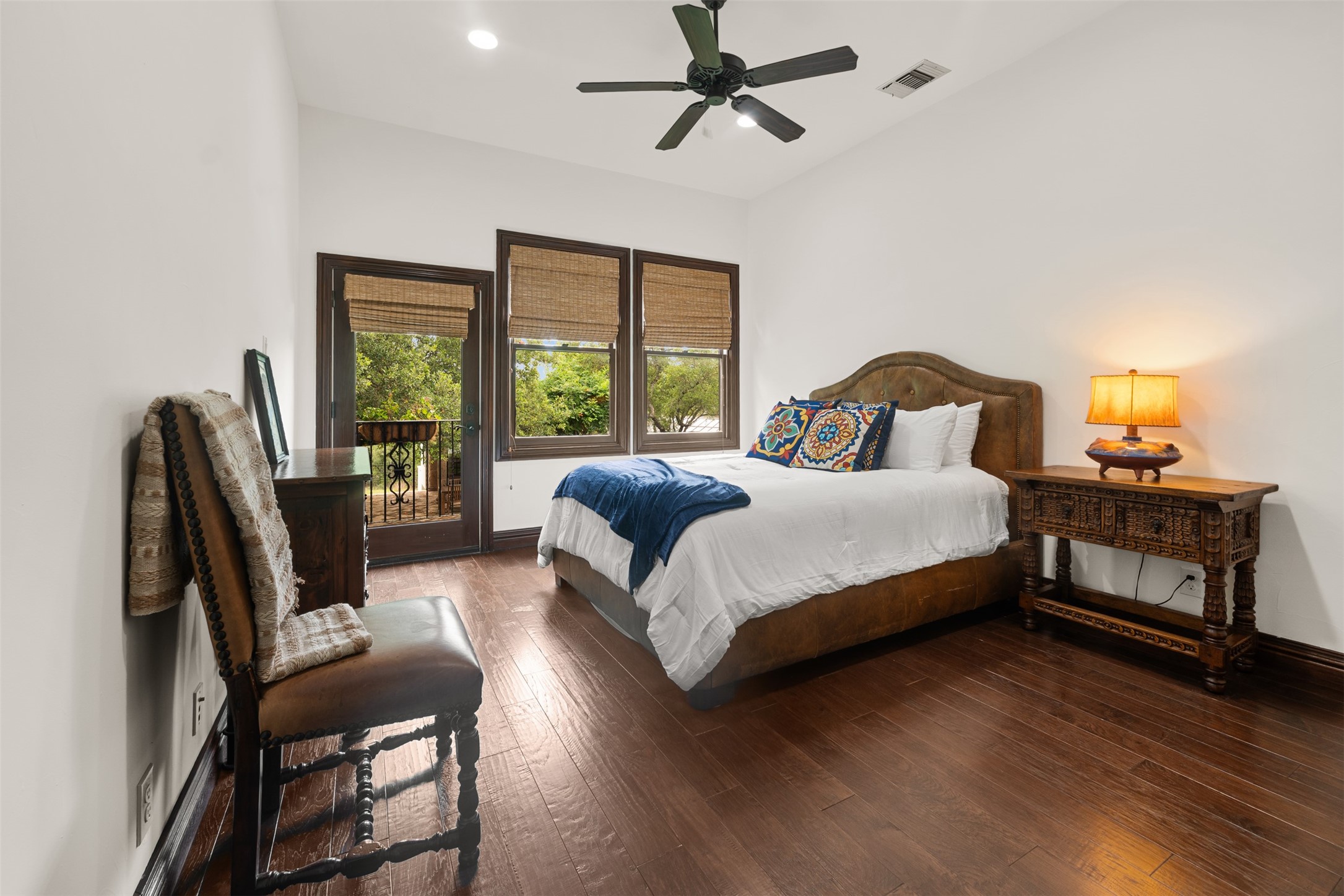 34000 Smithson Valley Road Bulverde, TX 78163 - Photo 13 of 50 A private guest retreat featuring hardwood flooring, abundant natural light, and direct access to a balcony overlooking the grounds. Guests will appreciate the peaceful setting and scenic views.