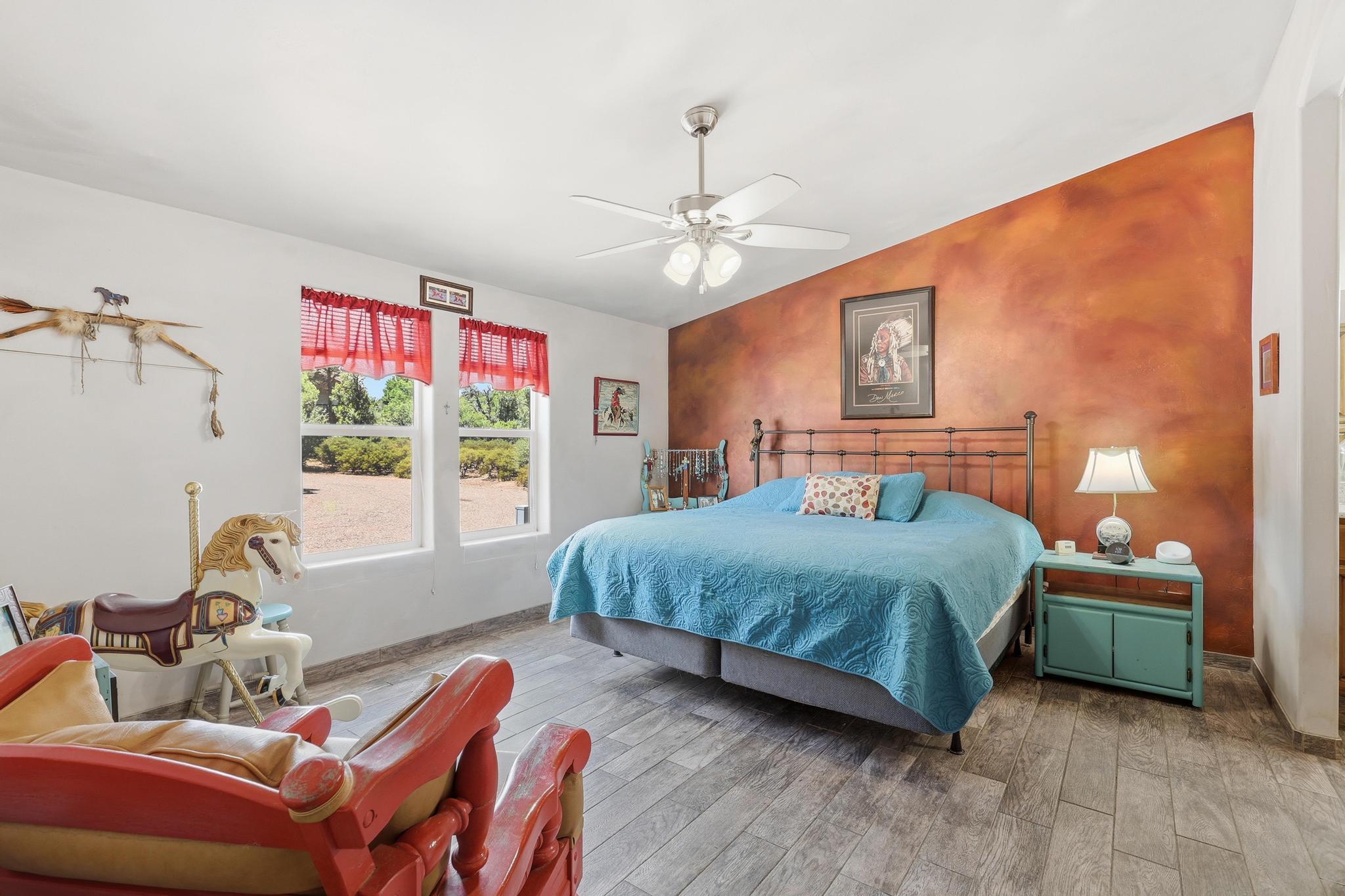 1211 Heather Circle Payson, AZ 85541 - Photo 12 of 51 a bedroom with a bed and a chandelier