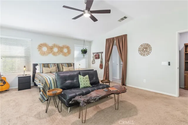 a view of patio with a table chairs and a yard