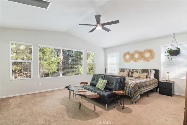 a view of patio with a table chairs and a yard