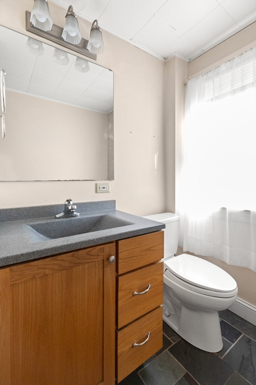 31 A Centre Street Danvers, MA 01923 - Photo 25 of 42 a bathroom with a granite countertop toilet sink and mirror