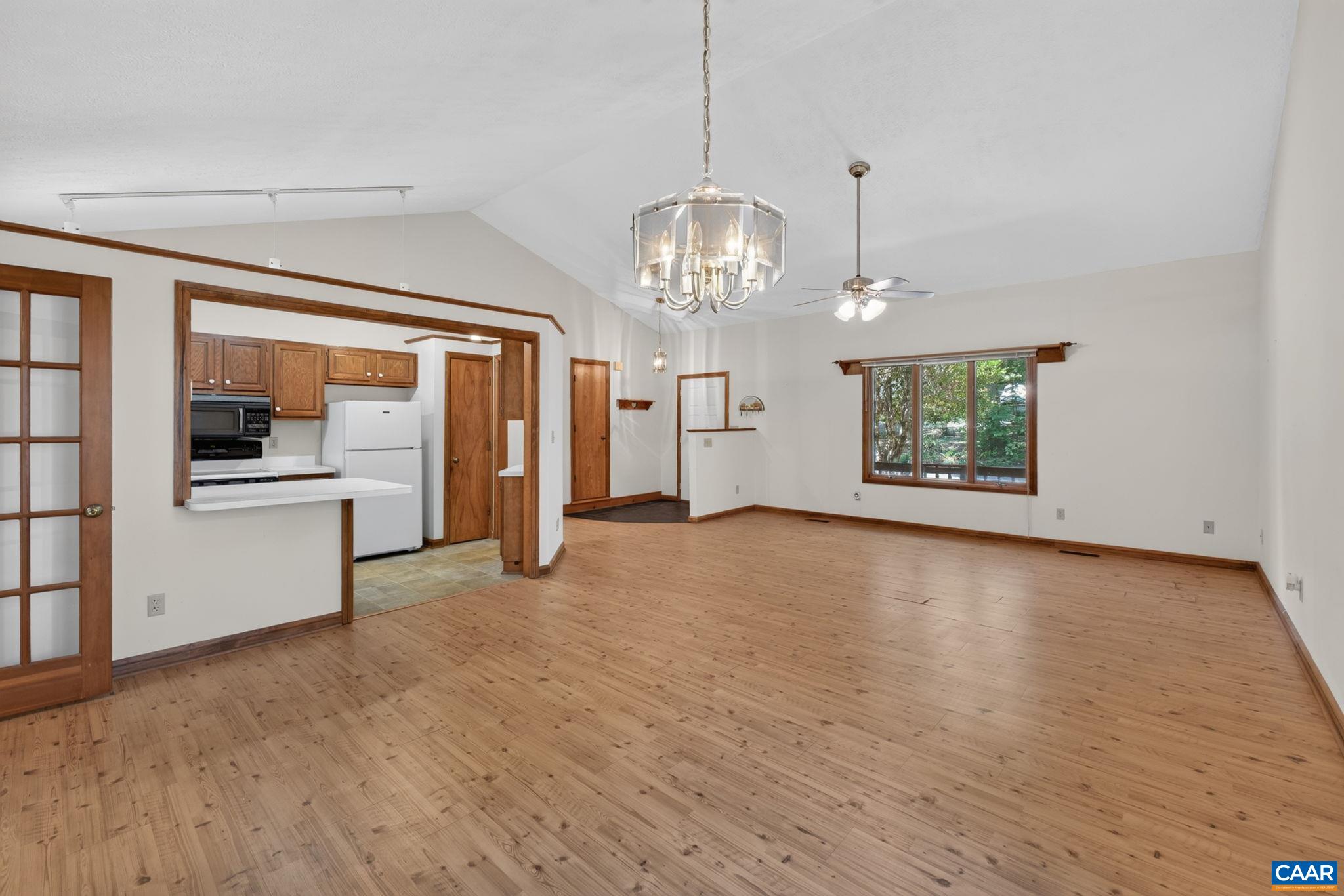 9 Timberlake Terrace Palmyra, VA 22963 - Photo 6 of 35 a view of a livingroom with wooden floor and kitchen space