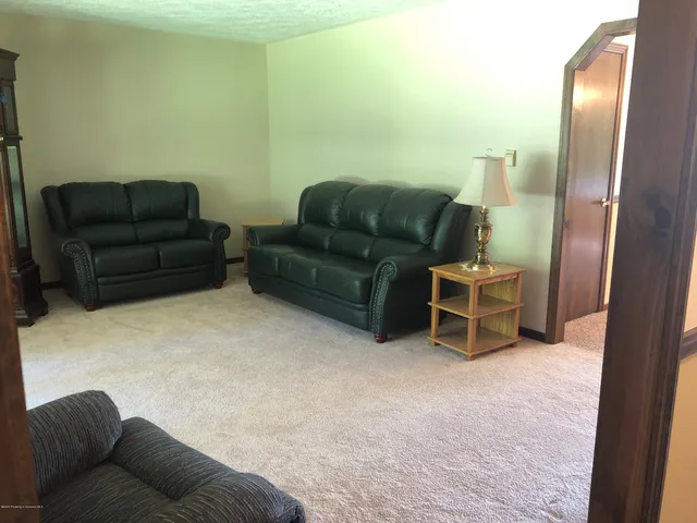 a living room with furniture and a couch
