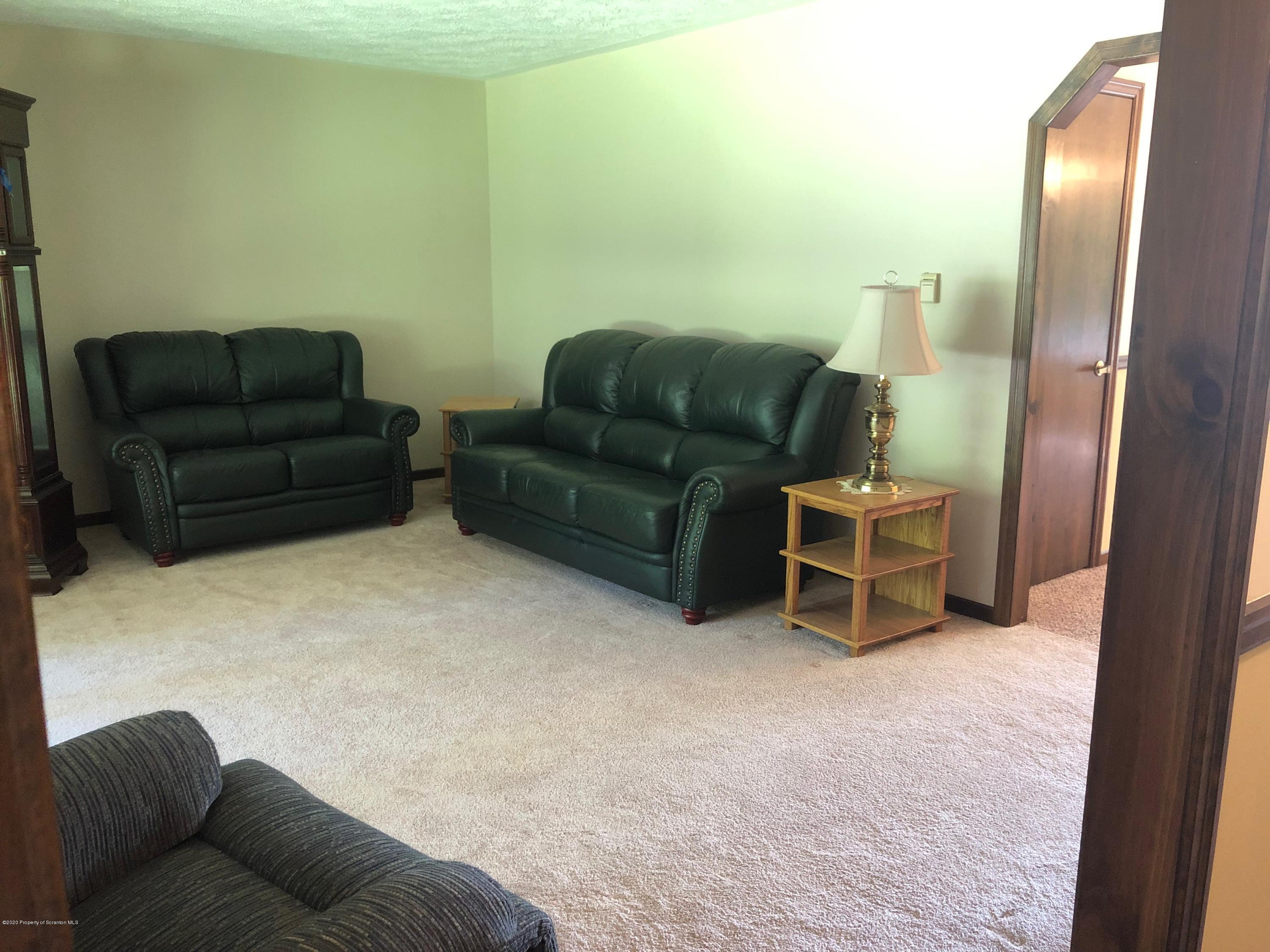 4262 Hamlin Highway Moscow, PA 18444 - Photo 8 of 13 a living room with furniture and a couch